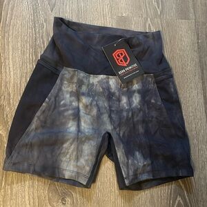 Born primitive, blue gray shorts, size M